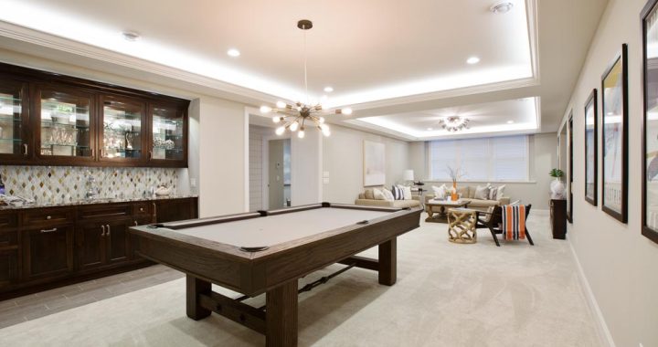Billiards table with kitchenette nearby for everything you need in the basement